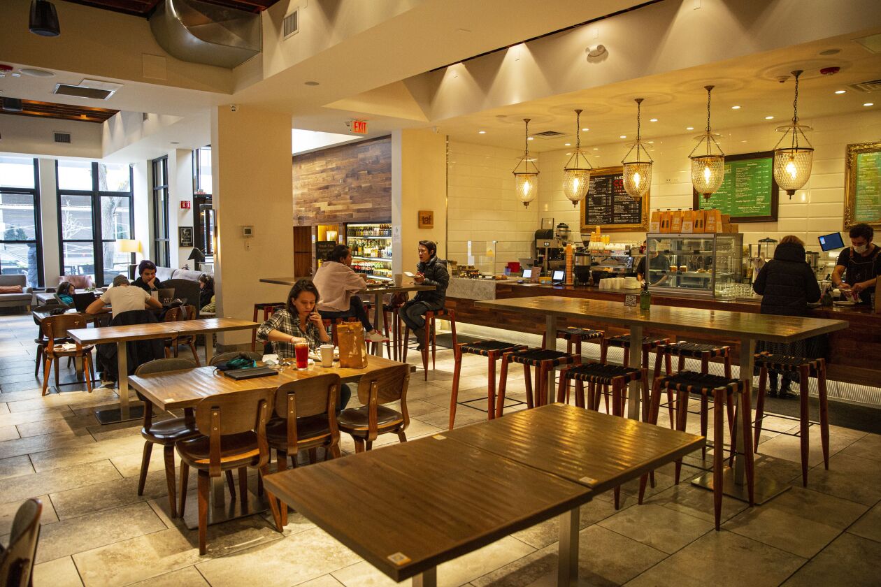 Patrons eat, work and socialize at Cupitol Coffee & Eatery in Evanston in late October.